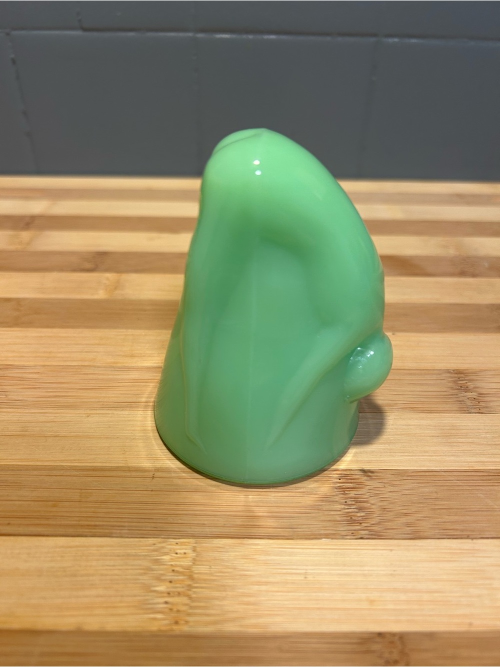 Reproduction? Of a Vintage 1930s jadeite uranium bottoms up shot glass.